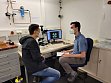 Aaron Miller with his supervisor Yu Qiang in the optical microscopy lab.